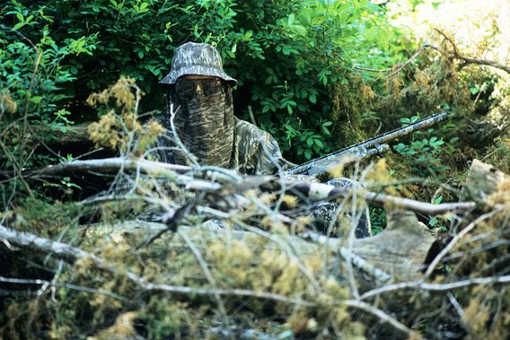 turkey hunter in camouflage gear